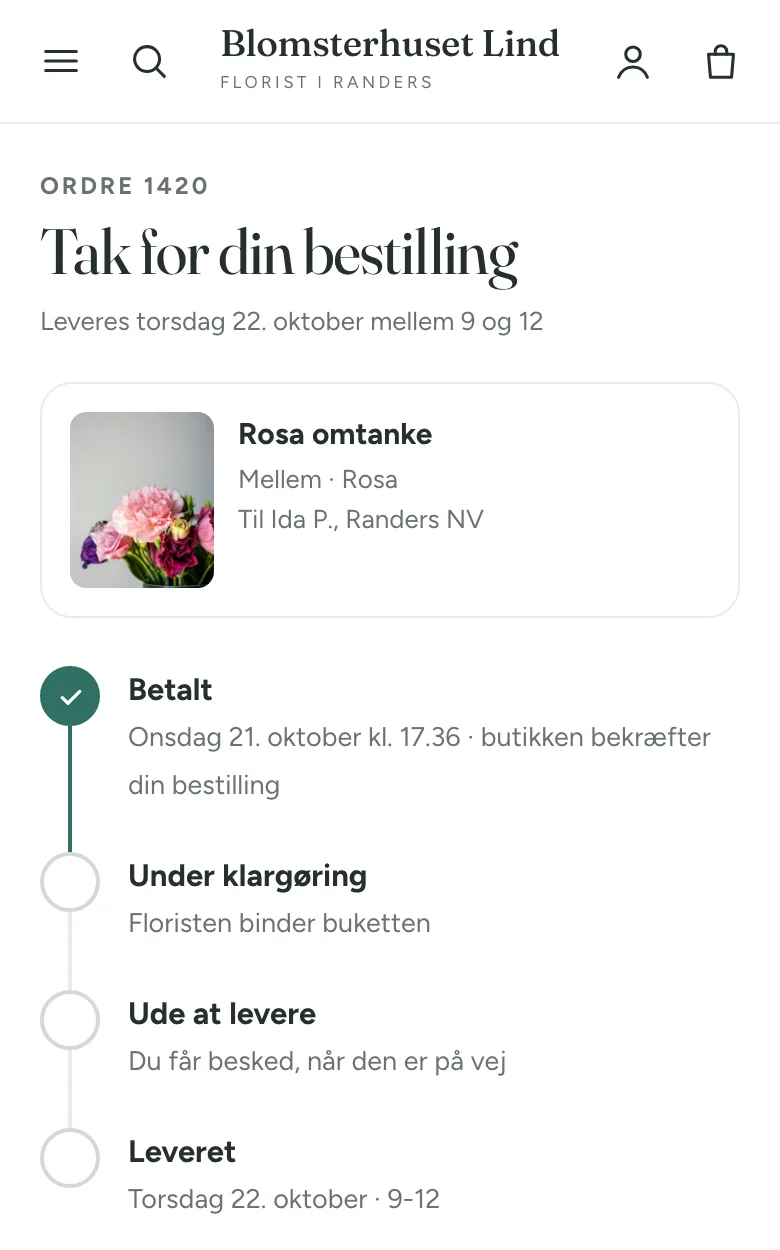 Statussiden på en telefon med ordre 1420, levering torsdag 22. oktober mellem 9 og 12, buketten og status Betalt