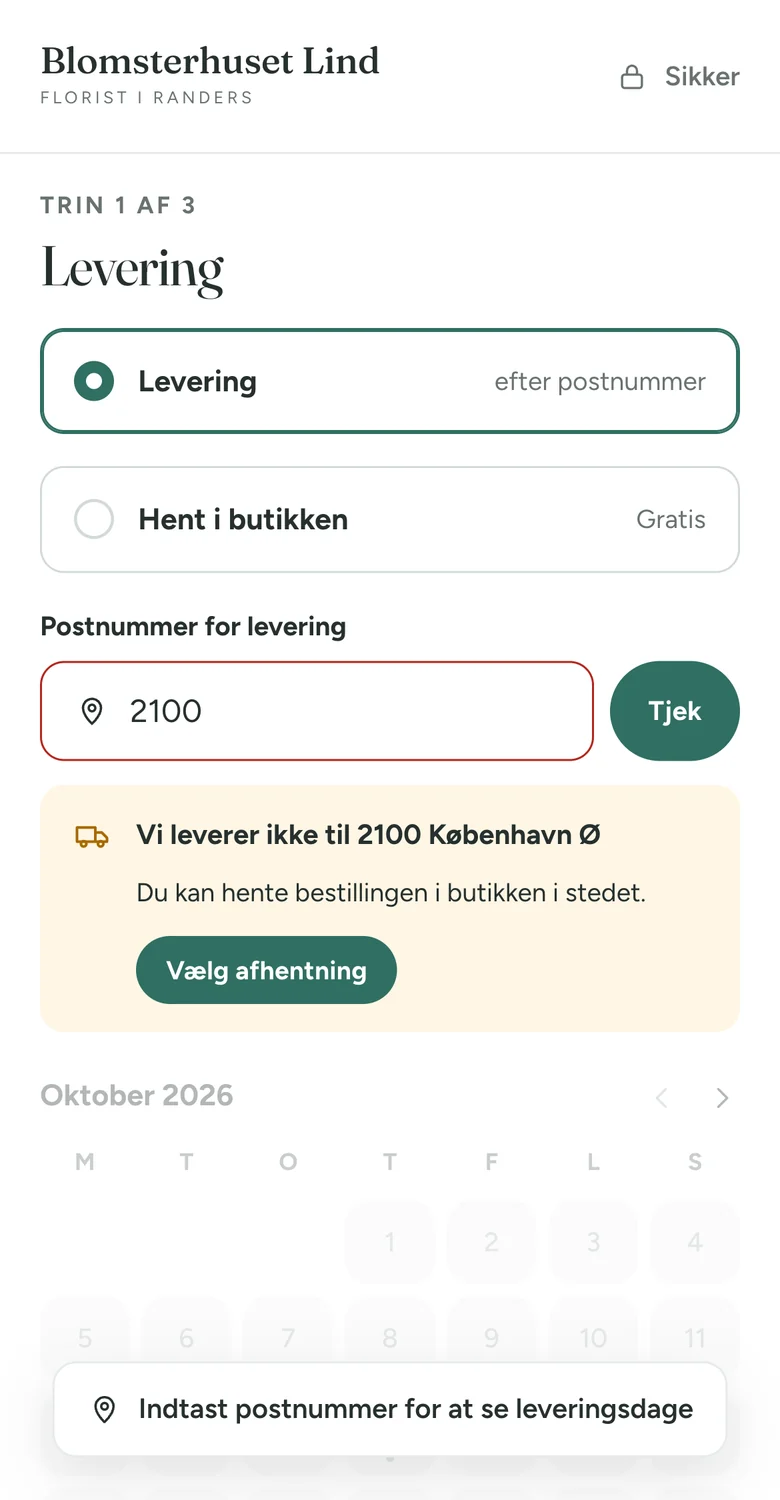 Kassens leveringstrin på en telefon: postnummer 2100 giver beskeden Vi leverer ikke til 2100 København Ø og en knap til at vælge afhentning.